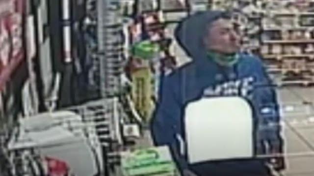 VIDEO: Robbery suspect seen with mask down briefly before pointing gun at clerk