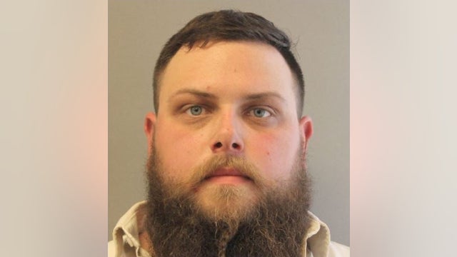 Man arrested, accused of threatening pizza delivery driver with rifle in Harris Co.