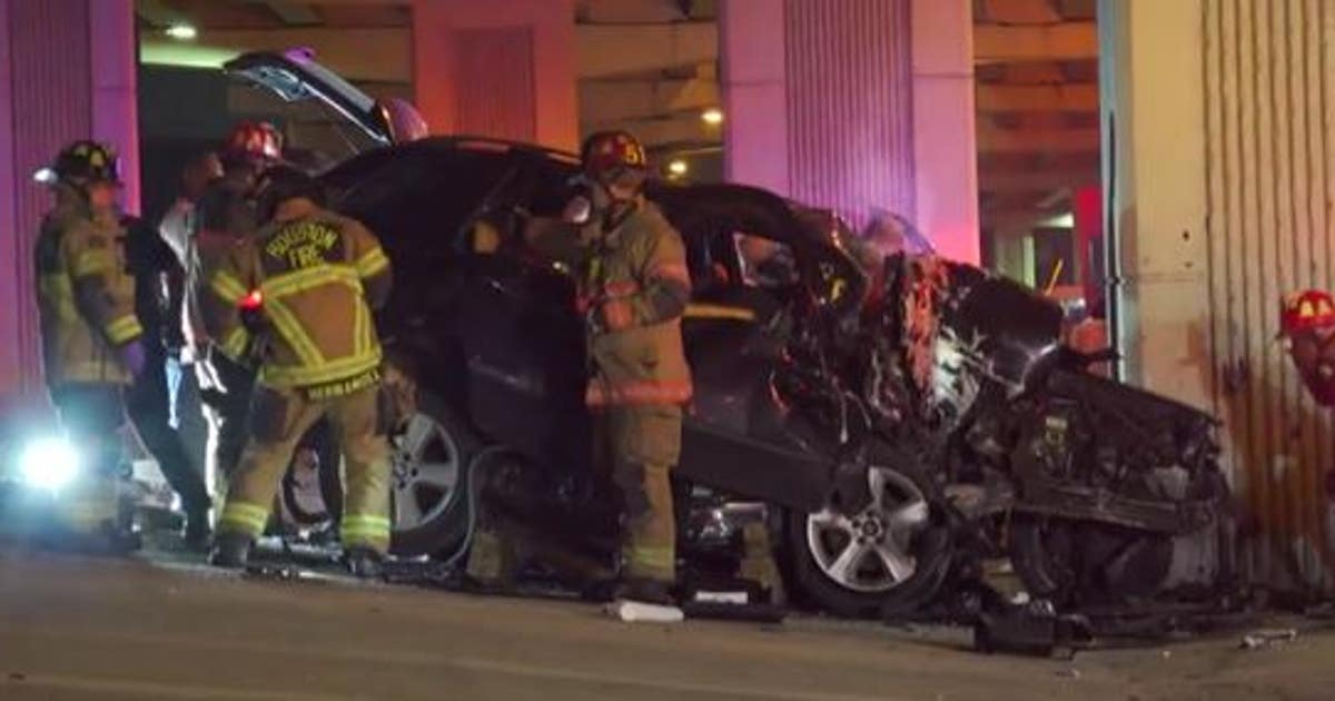 Driver trapped in her SUV after crashing into a concrete pillar on west ...