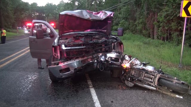 Motorcyclist killed, passenger injured after head-on crash with truck carrying tree debris