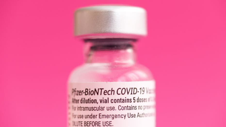 In this photo illustration a vial of Pfizer BioNTech vaccine