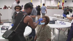 Hundreds of Haitian migrants begin arriving to a holding shelter in Houston