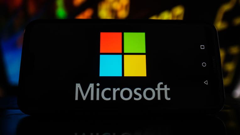 In this photo illustration a Microsoft logo seen displayed