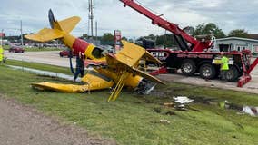 VIDEO: Small plane's wing clips side of billboard, crashes into ground