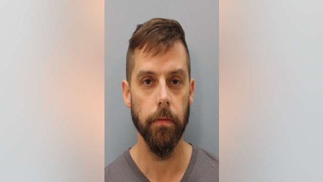 Man charged with murdering his wife, 'making it look like she was killed by an intruder'