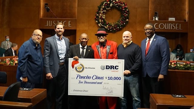 $10,000 check presented to Pancho Claus during Houston City Council meeting