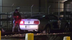 Police chase ends with driver stuck on railroad tracks in downtown Houston