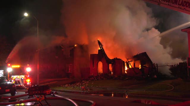 Brick wall collapses on Houston firefighter during house fire