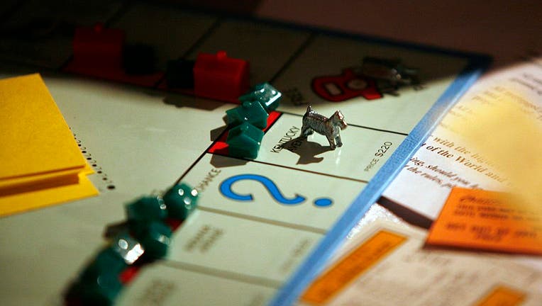 A game piece sits on the board game Monopoly, manufactured b