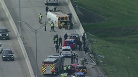 Fort Bend ISD school bus flipped on its side on toll road, no students on board