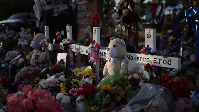 UVALDE, TEXAS - JUNE 03: Flowers, plush toys and wooden crosses are placed at a memorial dedicated to the victims of the mass shooting at Robb Elementary School on June 3, 2022 in Uvalde, Texas. (Photo by Alex Wong/Getty Images)