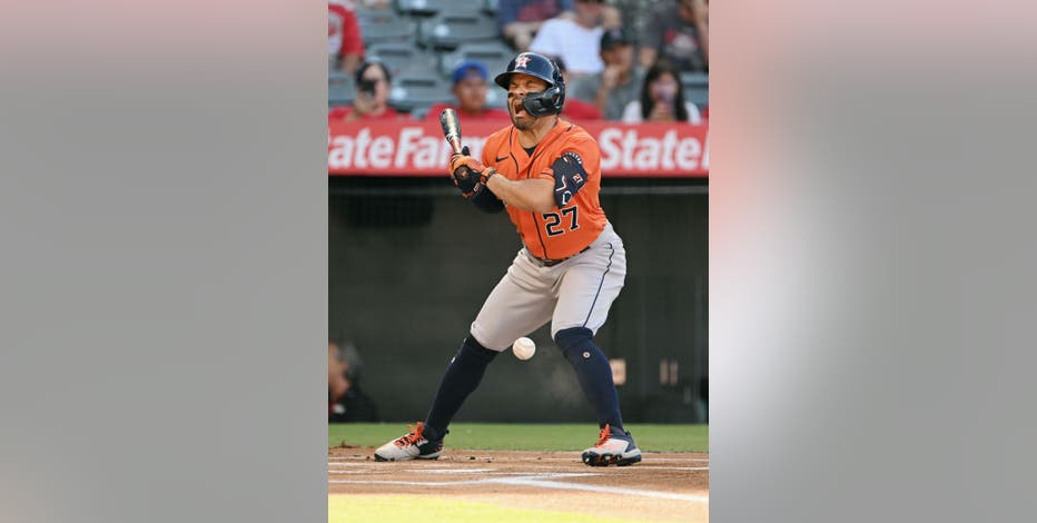 Astros' Jose Altuve exits after hit by pitch