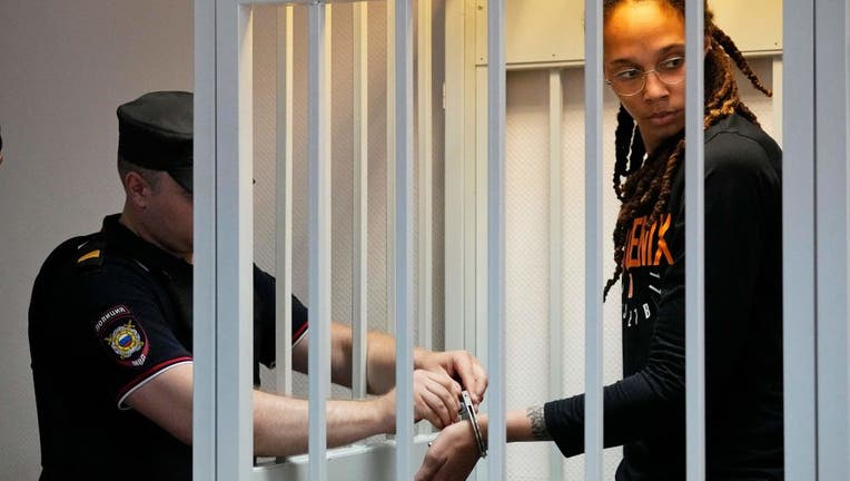 US WNBA basketball superstar Brittney Griner gets handcuffs taken off before a hearing at the Khimki Court, outside Moscow on July 27, 2022. 