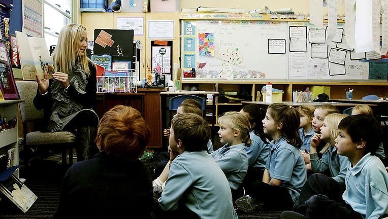 Teacher, Brianne Jones, reads to her year 1 class at Ainslie Primary School. Teachers are triall