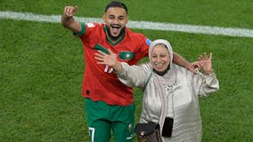 Morocco's Sofiane Boufal dances with mother after World Cup quarter-final win against Portugal