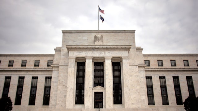 Fed raises key interest rate by half a point, signals more to come