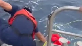 Coast Guard rescues fishermen after boat capsizes in rough seas