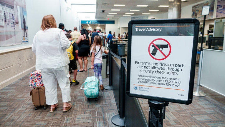 FILE - A TSA security screening checkpoint is pictured at an airport in Fort Lauderdale, Florida. (Photo by: Jeff Greenberg/Education Images/Universal Images Group via Getty Images)
