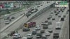 Trailer hangs from overpass along I-45