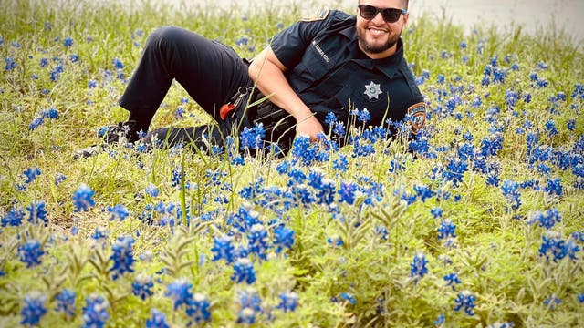 Harris County Sheriff's Office officials pose for pictures with Texas Bluebonnets