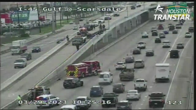 Trailer hangs from overpass along I-45 Gulf Freeway in Houston