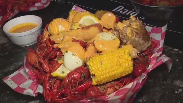 Checking out the menu at Daiq's in SW Houston this crawfish season