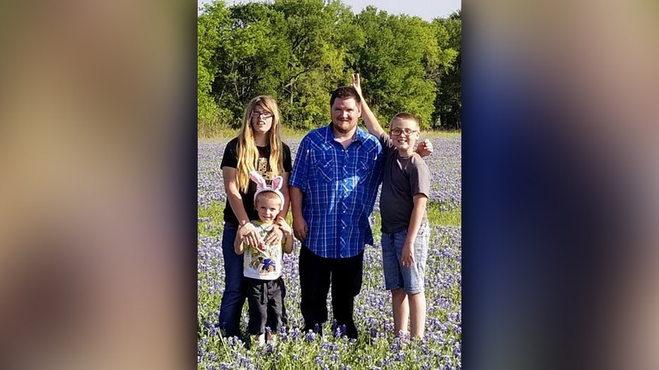 Matthew Boggs poses with his two sons and wife during an Easter celebration this year.