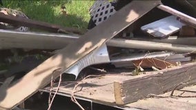 Spring residents still cleaning storm damage days later during heatwave