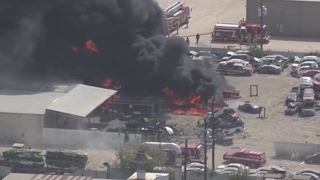 Houston fire: Cars burn at auto scrapyard on Holmes Road