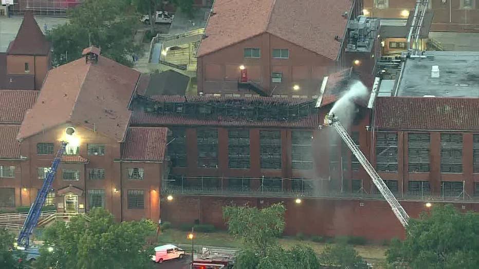 Firefighters battle a fire at the Huntsville Unit.