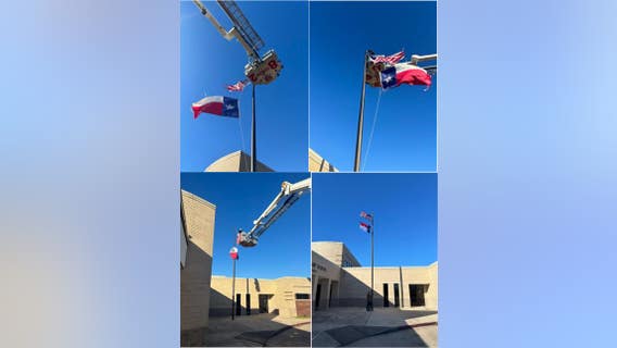 Crosby firefighters help elementary school replace flags damaged during Monday storms