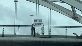 “CHIEF FINNER MUST GO!" sign posted on US-59 bridge at Mandell Street