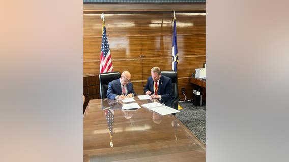 Houston firefighters hearing details of agreement signed by mayor, union president