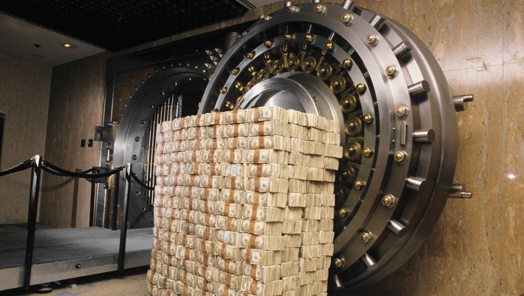 Money-stacked-outside-a-bank-vault.jpg