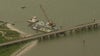 Company says barge broke loose from tow, drifted into Pelican Island Bridge