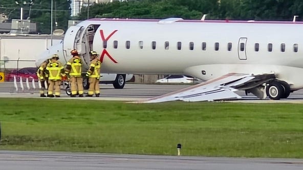 Small plane goes off the runway after landing gear collapse at Hobby Airport