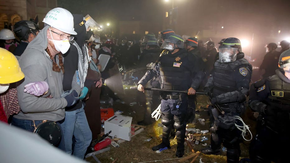 Police and protesters face off on the UCLA campus Thursday, May 2, 2024. (Jason Armond / Los Angeles Times via Getty Images)