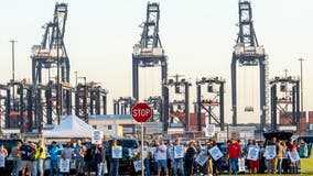 Dockworkers' union to suspend strike until Jan. 15 to allow time to negotiate new contract