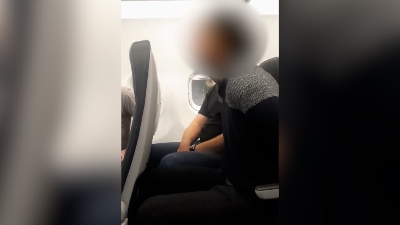 Unruly passenger on Frontier Flight tied up, allegedly was 'banging on the windows'