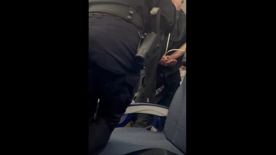 Houston-bound plane diverts to Seattle after passenger tries opening exit door mid-flight