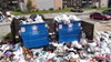 Waste management company sweeps in to help clean up Westbury Reserve Apartments