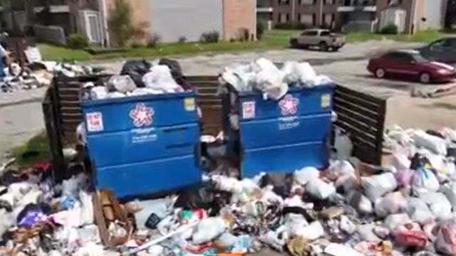 Waste management company sweeps in to help clean up Westbury Reserve Apartments