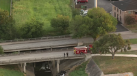 Car falls from bridge into Houston bayou; at least 1 dead