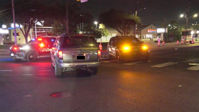 HPD patrol vehicle hit by driver running red light in Mid West area