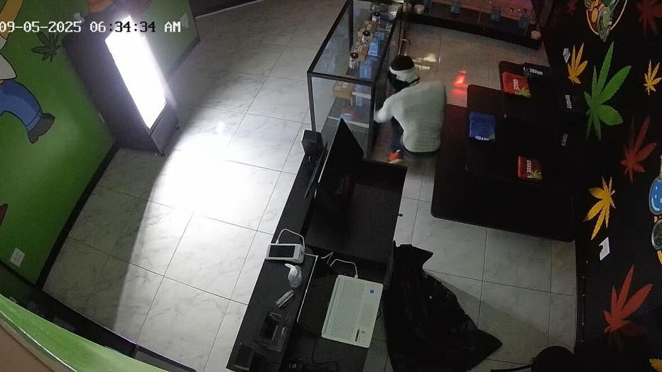Surveillance video images of a masked man breaking into Grade A Dispensary on Sept. 5.