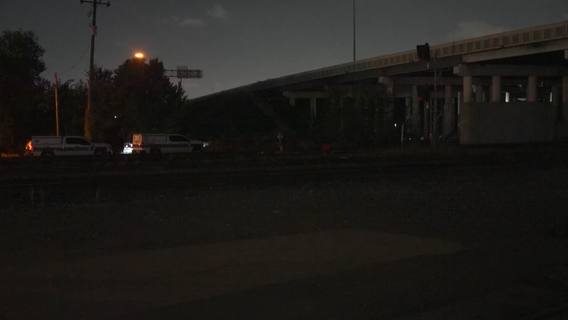 Man found on fire, hanging from rope under I-610 freeway; HPD investigating