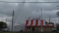 Water main break gushes water feet into air outside Houston Whataburger