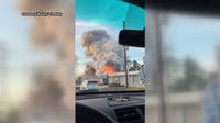 Authorities on scene of fire stand on fire near Hufsmith, Kuykendahl in Harris County