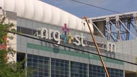 Why is the NRG Stadium sign being taken down in Houston?
