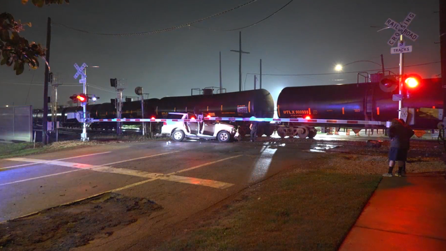 East Downtown train crash: Woman, 2 dogs inside vehicle hit by train